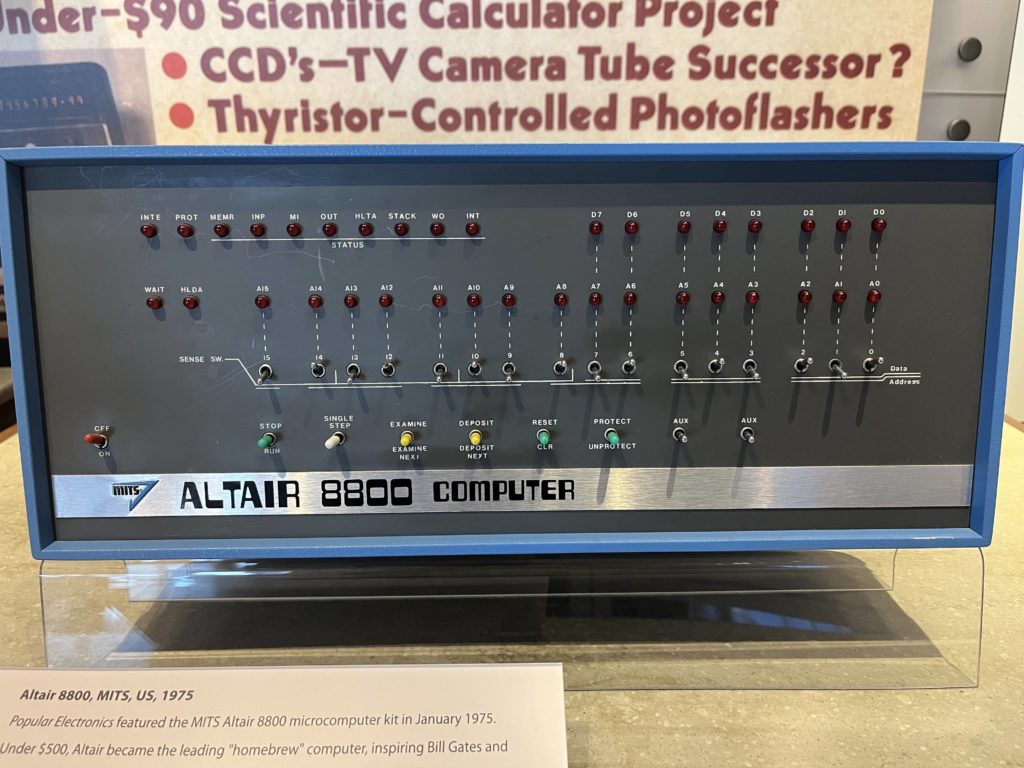 The front panel of an Altair 8800 computer, with an array of LEDs and switches controlling the state of individual bits.